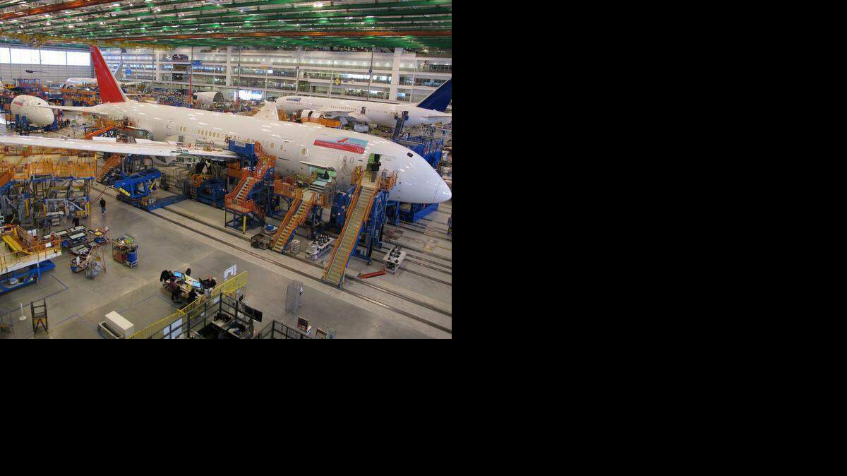 
Workers assemble Boeing 787 Dreamliners in the company's massive assembly plant in North Charleston, S.C., on Thursday, Dec. 19, 2013. After Boeing chose not to locate a new jet factory in North Carolina, public records showed the frantic behind-the-scenes recruiting effort by McCrory’s administration, including a meeting between the governor and Boeing officials, possible sites for the factory and the state’s $683 million incentives offer. 
