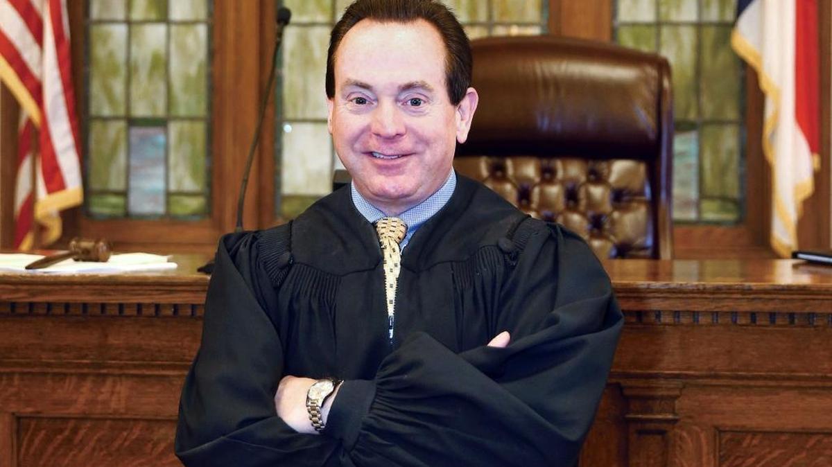 Senior Resident Superior Court Judge Arnold Jones stands in the main courtroom of the Wayne County Courthouse where he practices in Goldsboro. Jones was arrested Wednesday morning and charged with attempting to bribe an FBI agent with beer and cash to obtain copies of text messages involving members of his family.