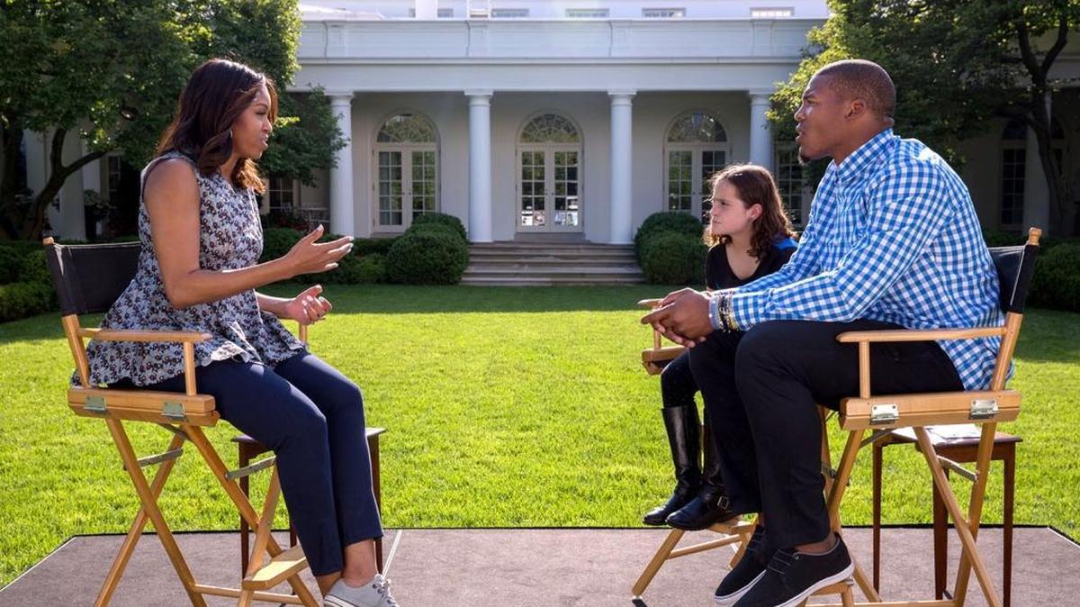 First Lady Michelle Obama participates in a Nickelodeon interview with fourth grade student Rosie Smolowitz of Charlotte and Cam Newton in the White House Rose Garden on May 24.