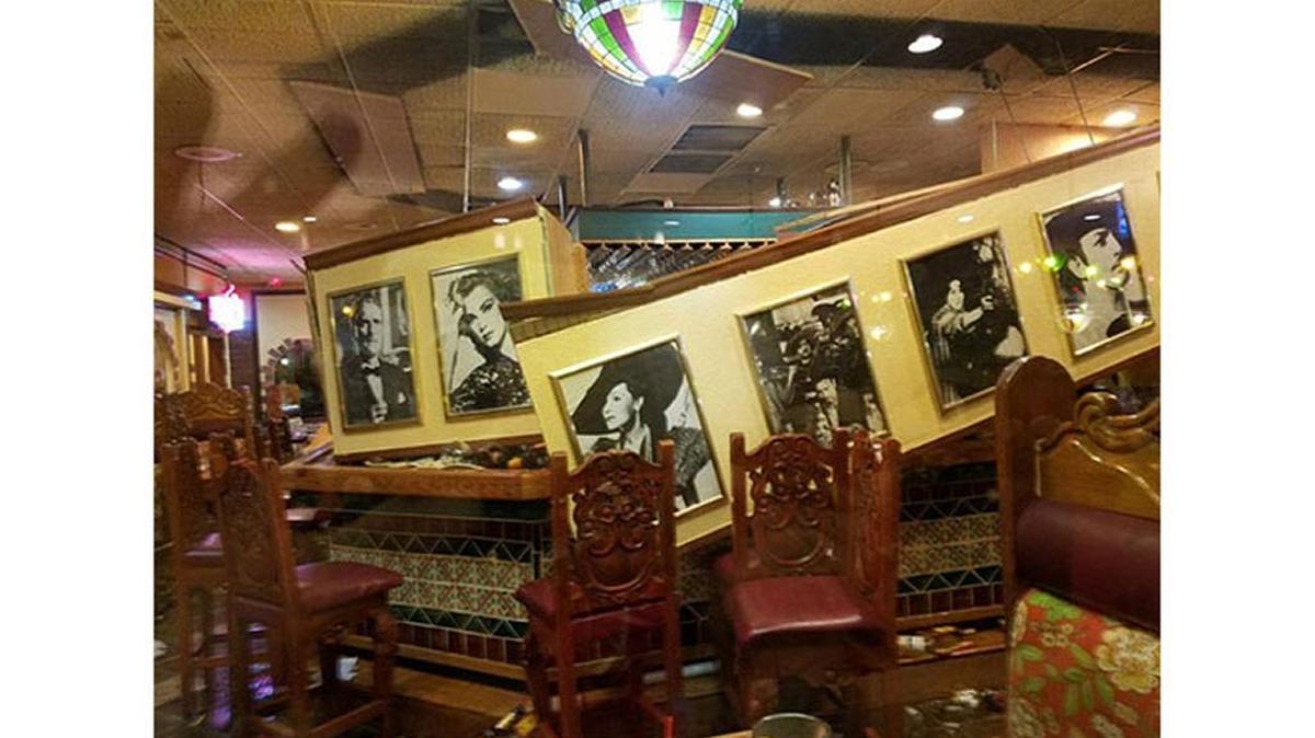 Two people were treated for minor injuries after part of the bar attached to the ceiling of a Matthews restaurant collapsed on Friday night, Observer news partner WBTV reported.