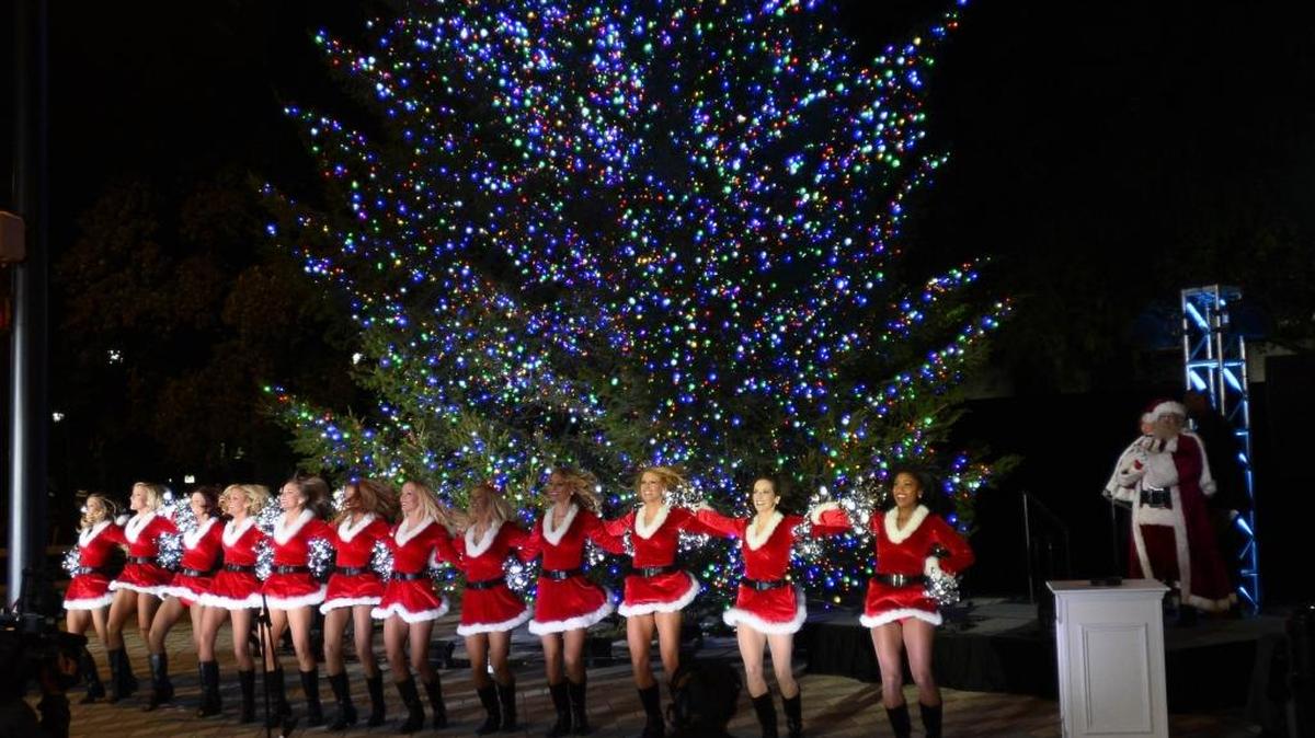 Members of the Carolina Panthers TopCats and Santa Claus danced last year just after the team’s tree lights came on.