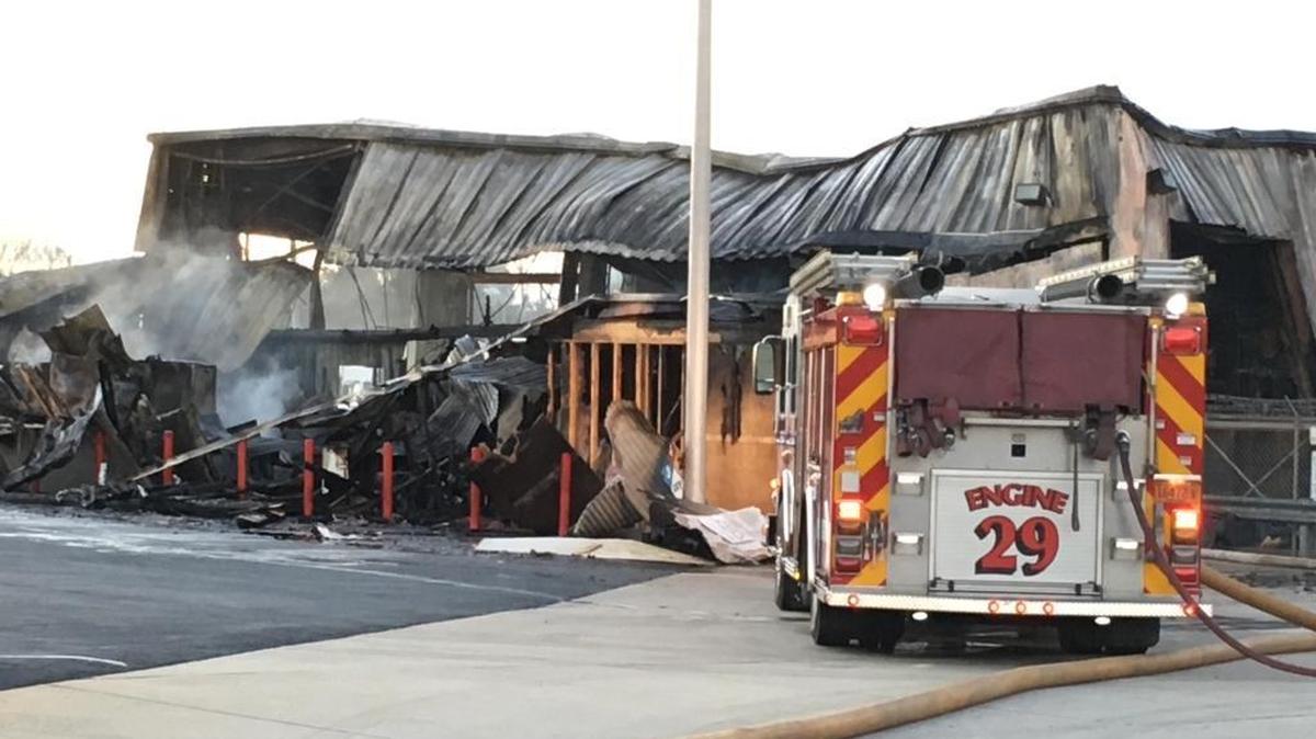 About 60 firefighters battled a warehouse fire that closed West Craighead Road in north Charlotte early Wednesday.