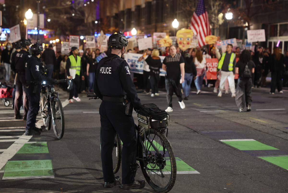 Charlotte Mecklenburg police officers block a street in uptown Charlotte Thursday, Jan. 8, 2026 for protesters.