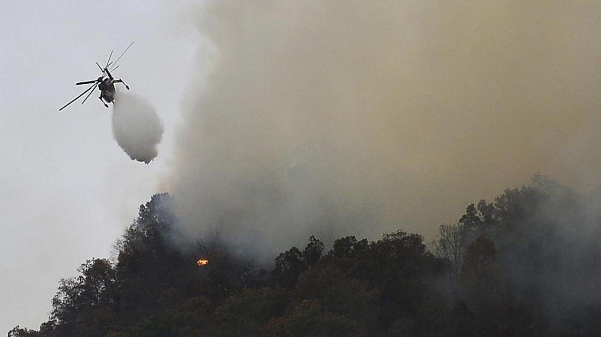 Crews work a wildfire near Lake Lure, N.C., on Friday.