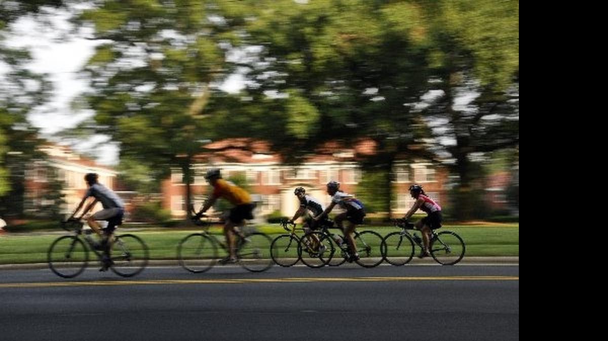 
Riders pass Queens University of Charlotte during 24 Hours of Booty

