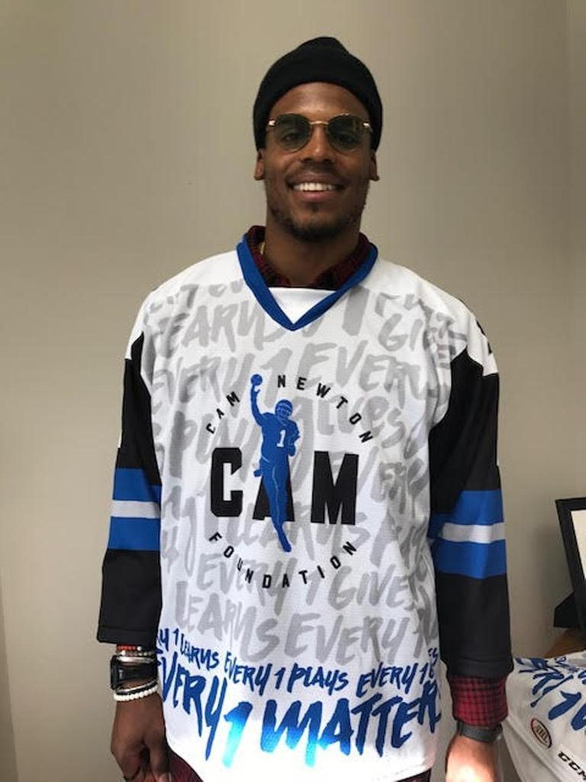 Cam Newton’s design for Charlotte Checker’s jersey includes Carolina Panthers colors.