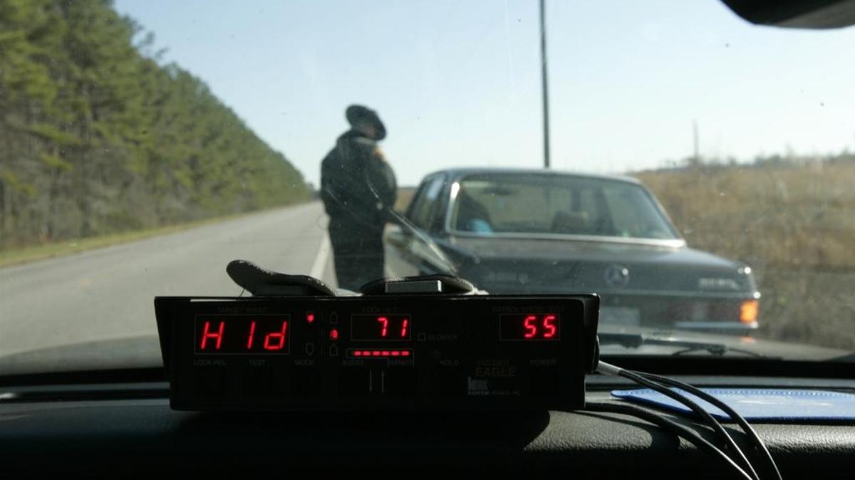 A North Carolina Highway Patrol trooper gives a driver a speeding ticket on U.S. 64 in Tyrrell County.