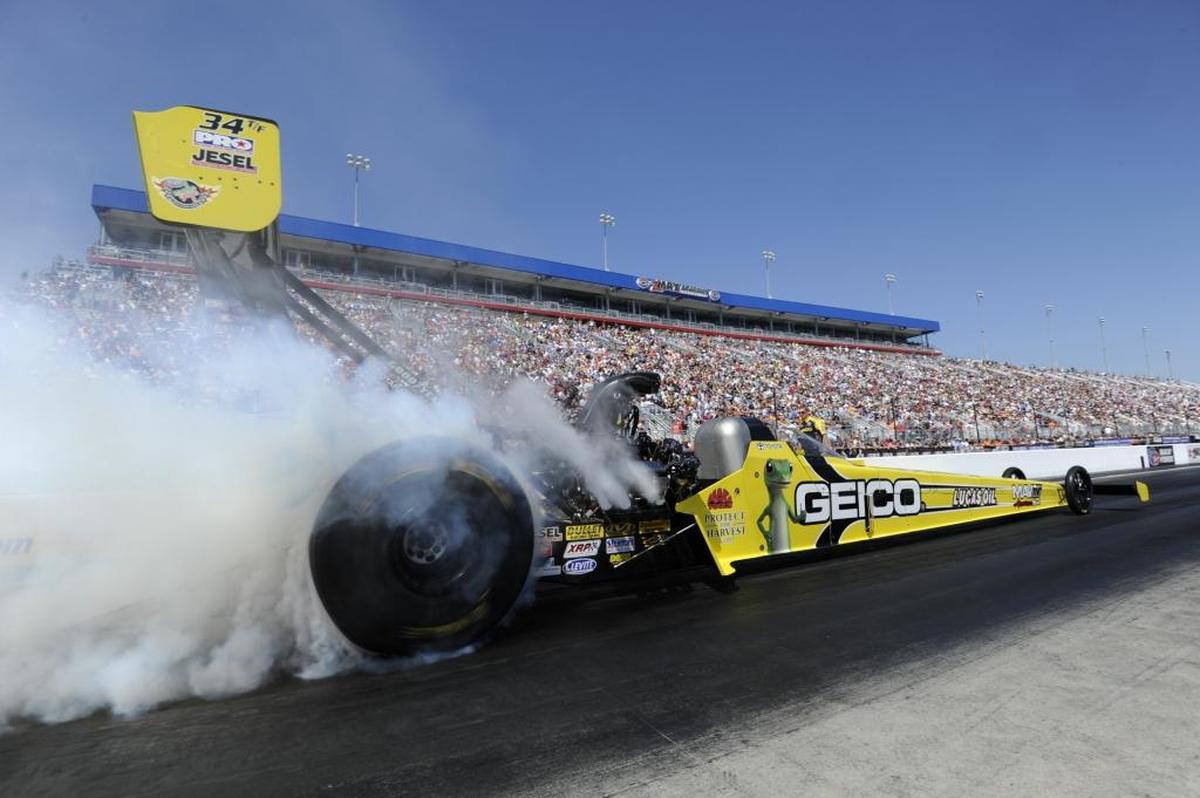 In this photo provided by NHRA, Morgan Lucas takes part in Top Fuel qualifying at the Carlyle Tools NHRA Carolina Nationals drag races at zMAX Dragway in Concord in September 2013.