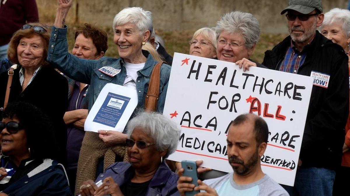 Terry Soffer, left, and Sue DuChanois show their support to the speakers opposing repeal of Obamacare in a January "Save Our Health Care" rally at Marshall Park, featuring health care experts and patients who oppose repeal of the Affordable Care Act.