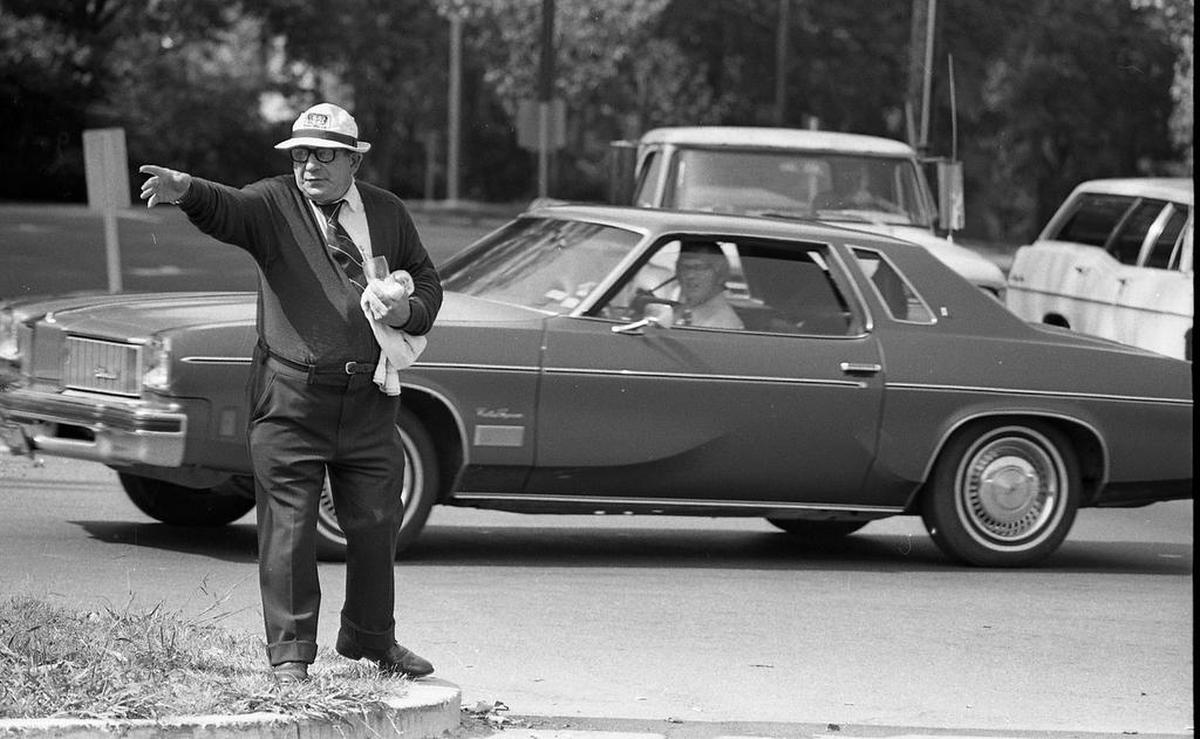 Hugh McManaway strikes the pose that was captured by Elsie Shaw in the statue she sculpted to commemorate the Myers Park man and his passion for directing traffic.