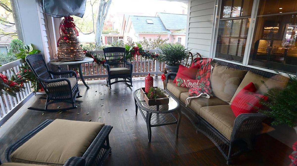 A cozy seating area on the back porch at the home of Brian and Brittani Phillips in Fourth Ward n November 2014. Their home, which was first built in 1903 and extensively remodeled in 2012, was featured on the 2014 Fourth Ward Holiday Home Tour.