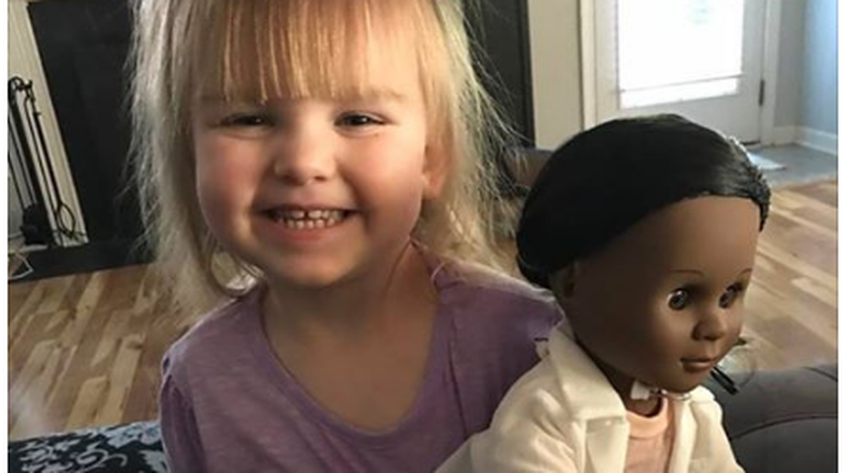 Sophia with her doctor doll.