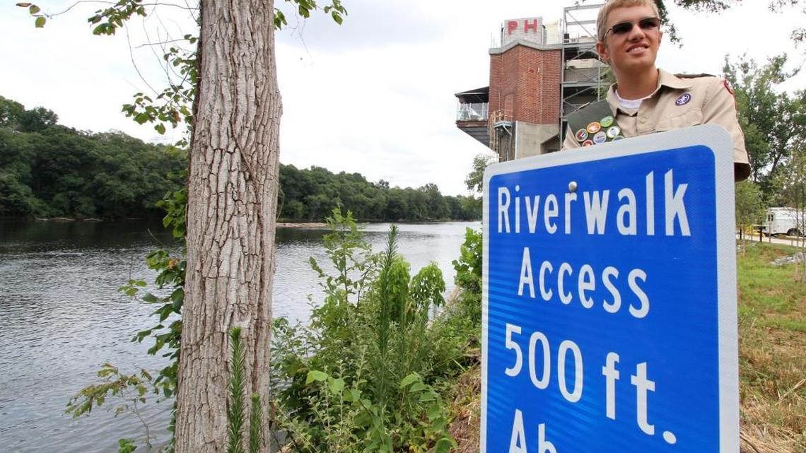 Harris Vaughan, 16, stands by a marker at the Catawba River in the Riverwalk community in York County, S.C.