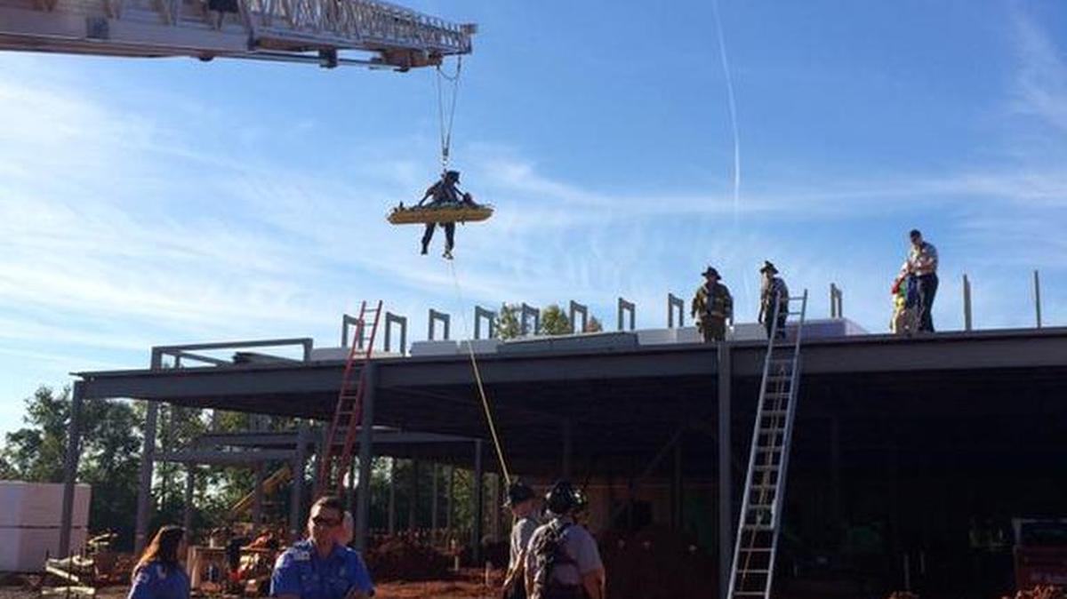 
Firefighters rescued a patient from the roof of a construction site on Wilkinson Boulevard Thursday morning. 

