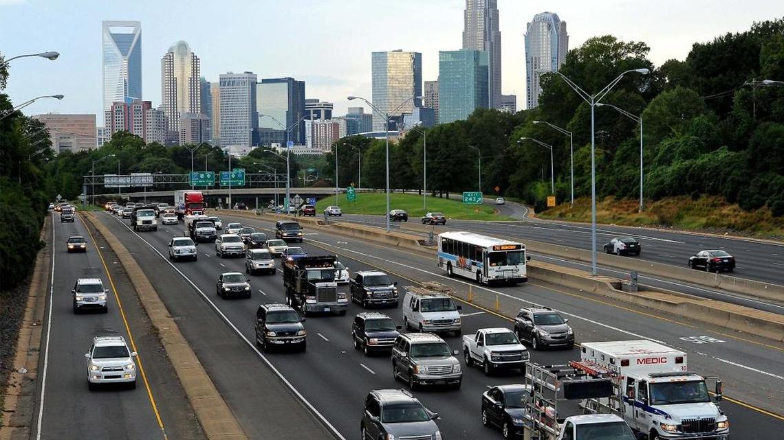 Commuters exit Charlotte on US 74. Propelled largely by growth in its two largest urban centers, North Carolina’s population crossed the 10 million mark in the past year.
