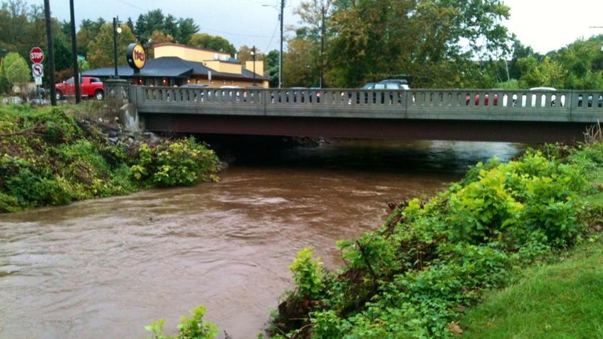 
At Bilmore Village near Asheville, the Swannanoa River rose to near flood level, but no threat to the town was expected.
