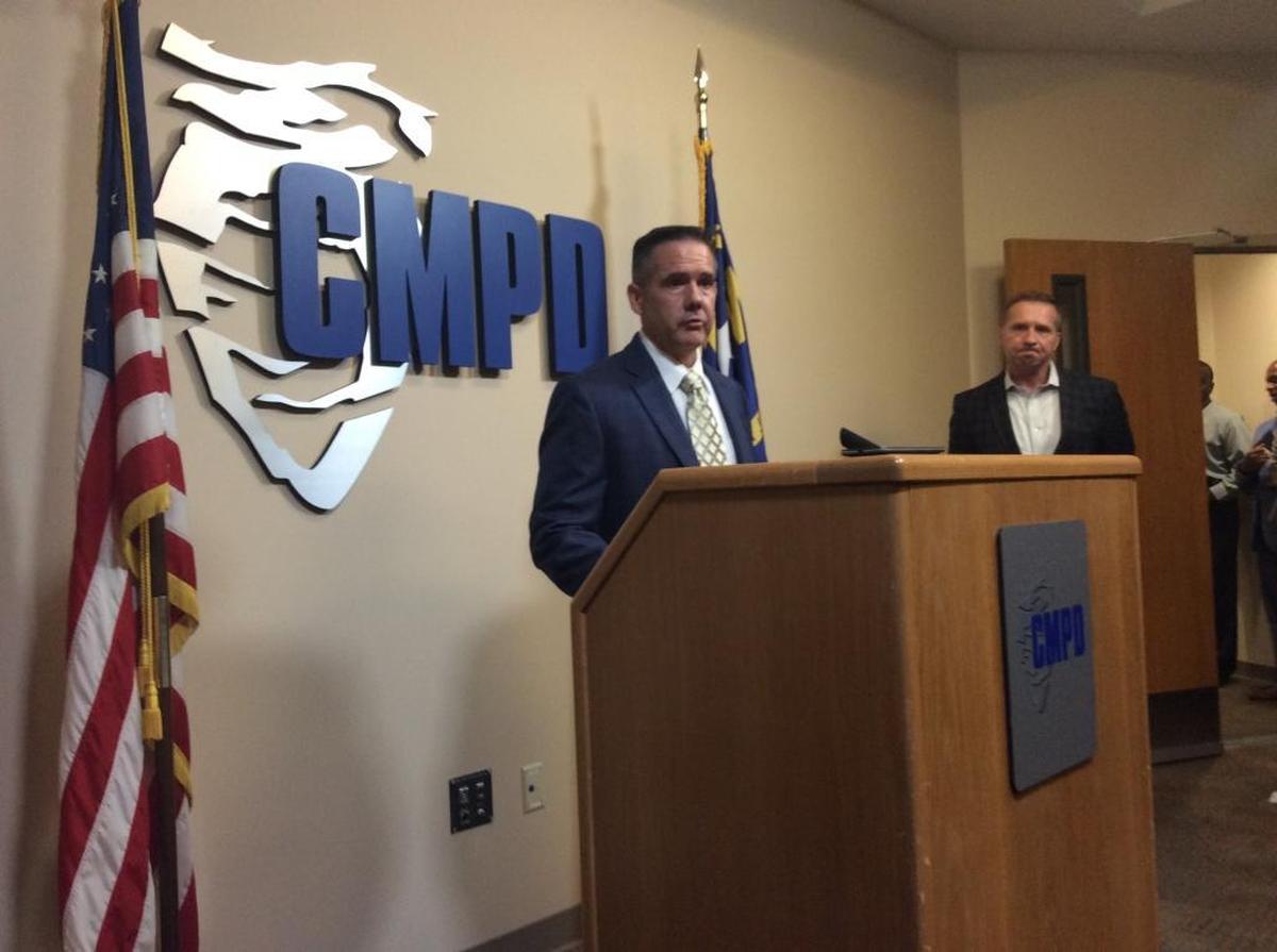 Charlotte-Mecklenburg Police Capt. Chris Dozier, left, and CMPD spokesman Rob Tufano, right, address reporters at CMPD headquarters on Friday about the arrest of a 15-year-old in the killing of 21-year-old Zachary Joseph Finch.