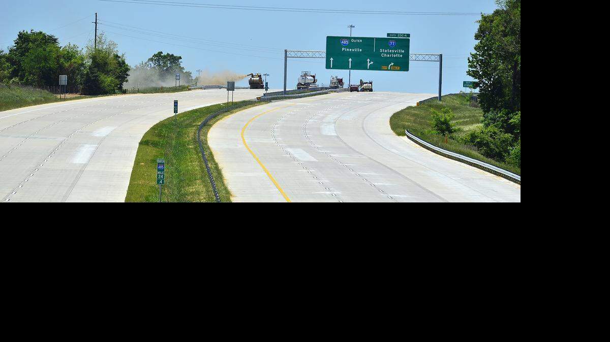 
Seen from Browne Road, grass seed is blown onto the side of I-485. I-485 construction continued on Wednesday, May 13, 2015 on a soon-to-open stretch between N.C. 115 to I-85 and the last portion that will complete the loop around Charlotte.
