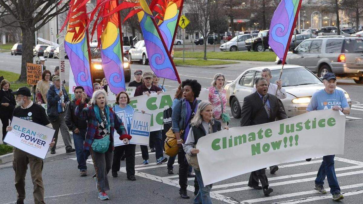 After a rally held at Marshall Park on Dec. 16,2015, protesters march to the Government Center to protest NC's response to a federal plan to reduce carbon dioxide emissions from power plants. Called March for Climate Justice.