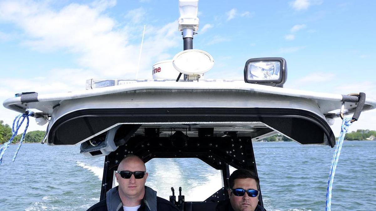 Cornelius Police Department lake patrol officers Collin Rhinehardt, left, and Mat Ferrucci gave a quick tour of Lake Norman near Blythe Landing to media members who attended a lake safety press conference in May 2016.