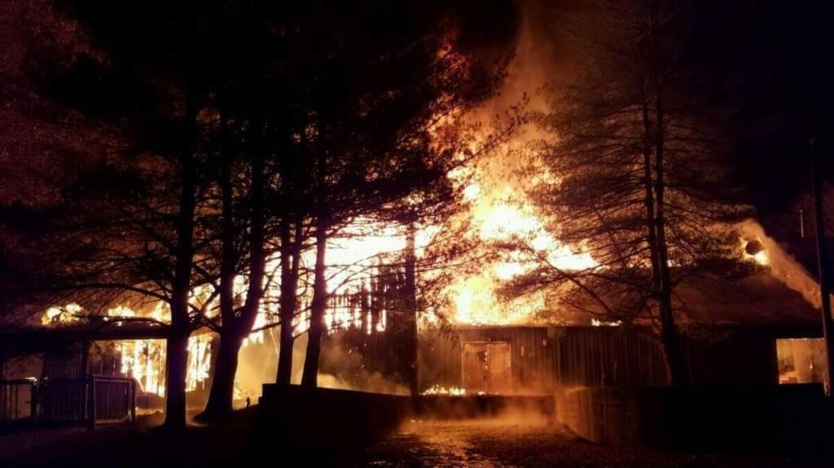 Flames rise up to 30 feet as Belk Dining Hall as it burned Sunday night.