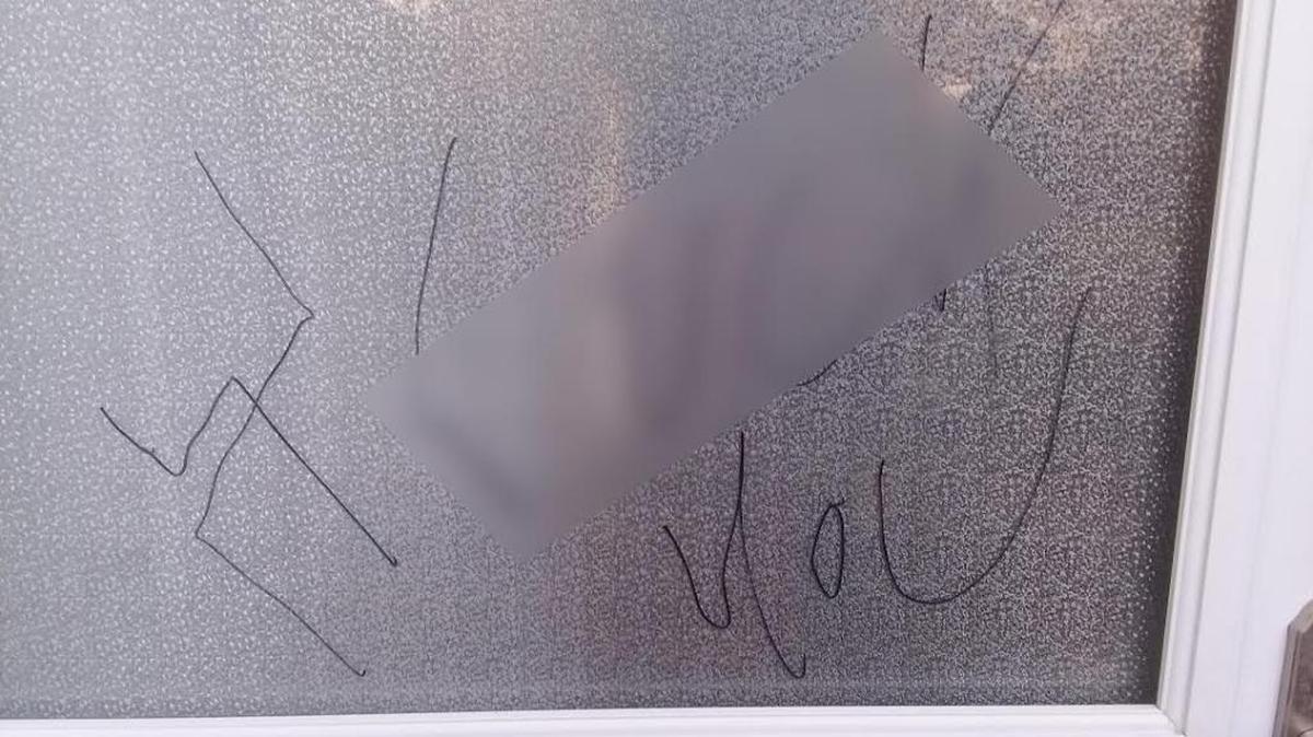 A couple in southwest Charlotte returned home after a Rosh Hashanah event to find a swastika and profanity written on their door. The profanity has been blurred out by the Observer.