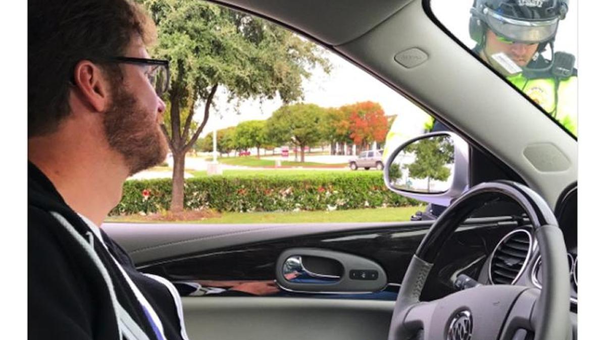 Earnhardt’s fiancee, Amy Reimann, was in the car with him and posted a photo on Twitter of the officer writing him a warning.