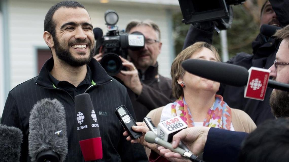 Omar Khadr smiles as he speaks to the media outside his lawyer Dennis Edney's home in Edmonton, Alberta, in 2015. The former Guantanamo Bay prisoner had his first taste of freedom in almost 13 years Thursday after an Alberta judge rejected a last-ditch attempt by the federal government to block his release.