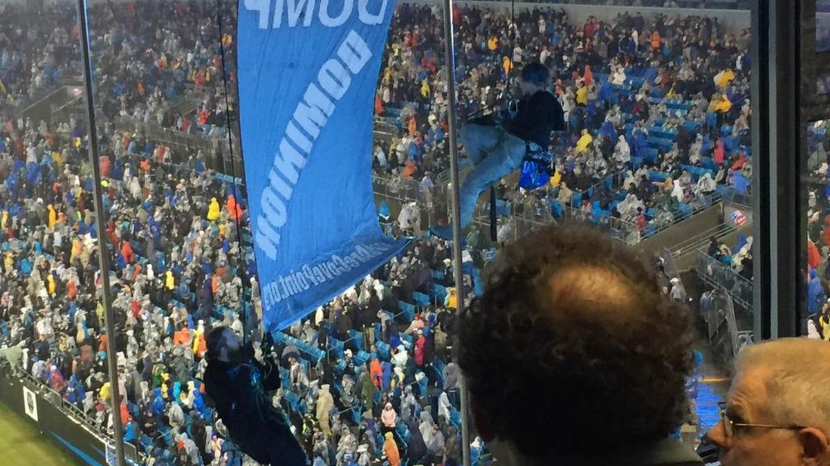 Activists protesting Bank of America’s financing of a liquefied natural gas facility in Maryland suspended themselves from the upper deck of BofA stadium during the Panthers’ Monday Night Football game.