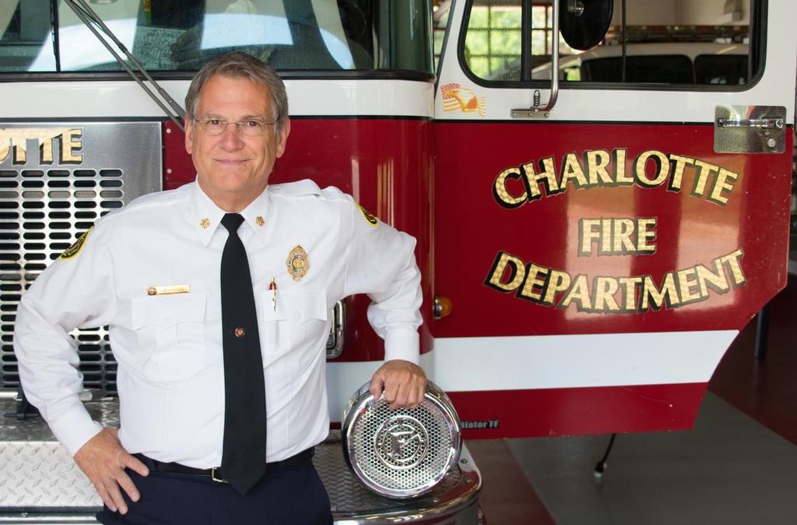 Charlotte Fire Chief Jon Hannan stands in front of a fire engine in Charlotte Fire Station 42. The Charlotte Fire Department recently received new funding from the city to help develop and grow the department to better serve the community.