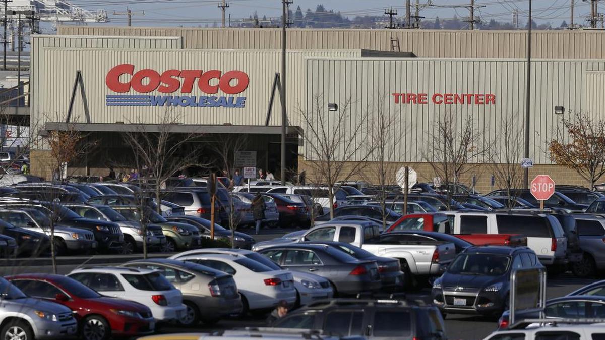Cars fill the parking lot of a Costco store in Seattle.