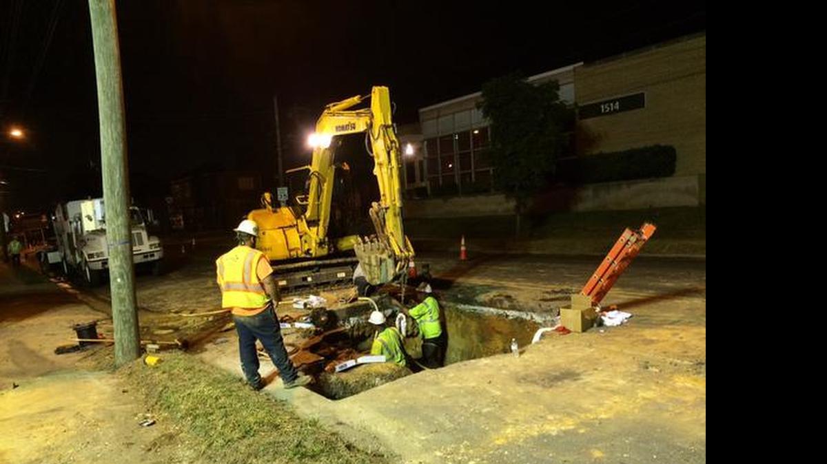 
Crews repair a water main break on North Graham Street in Charlotte on Wednesday morning.

