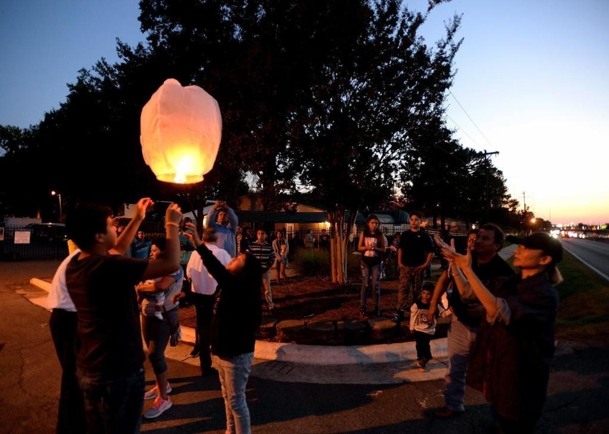 Friends and family release a floating candle as they grieve during a vigil to remember Ruben Galindo. On Sept. 6, Ruben Galindo was shot to death by Charlotte-Mecklenburg police officers.