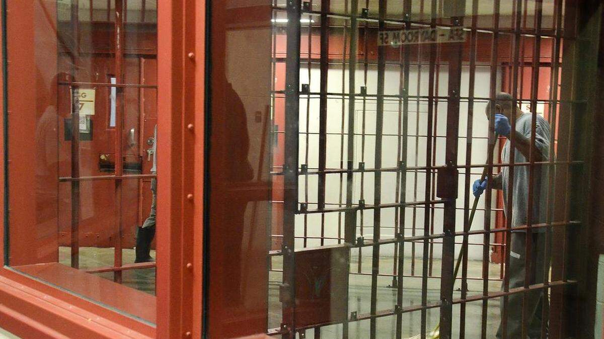 In this file photo, an inmate is shown mopping the floor at a prison in Anson County. 