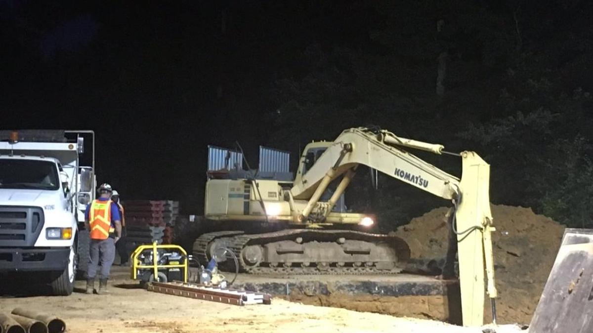Crews continued to work Friday morning on a water main break that occurred on David Cox Road between Old Sugar Creek Road and the West Sugar Creek Road intersection, and caused a sinkhole.