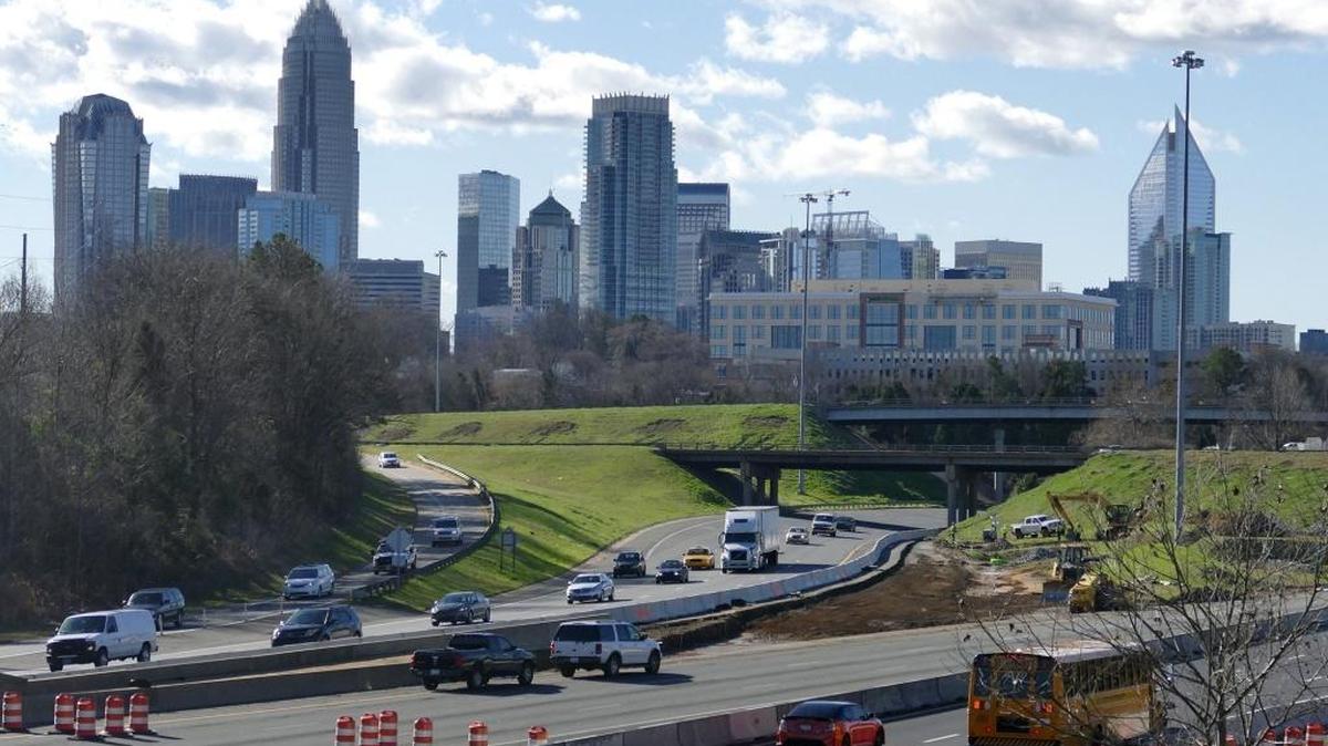 Traffic streams down Interstate 77 in Charlotte. A local group is among plaintiffs suing federal transportation agencies over suspension of a regulation that requires reporting of greenhouse gas emissions from federal highways.