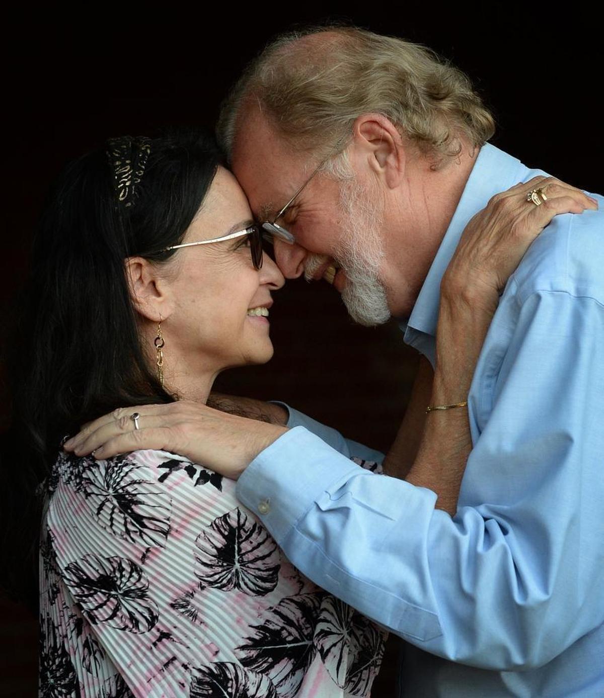Susan Supernaw and Tom Tate share a tender moment as a married couple.
