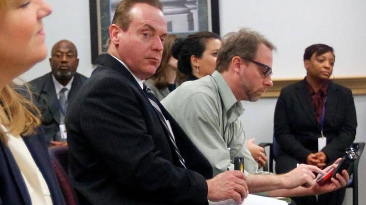 Wayne County Judge Arnold Ogden Jones, (second from left) attends a meeting of the NC Innocence Inquiry Commission Dec. 5, 2014 in Raleigh, NC. Jones, chairman of the commission, was charged in Federal Court Wednesday, Nov. 4, 2015 with trying to bribe an FBI agent with beer and cash to obtain copies of text messages involving members of his family.
