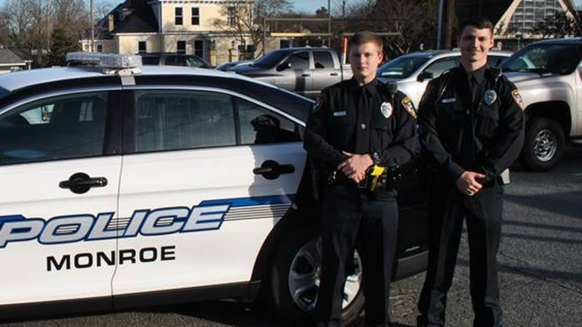 Corey Helms and Dylan Cole on January 18, when they were sworn in at the Monroe Police Department.