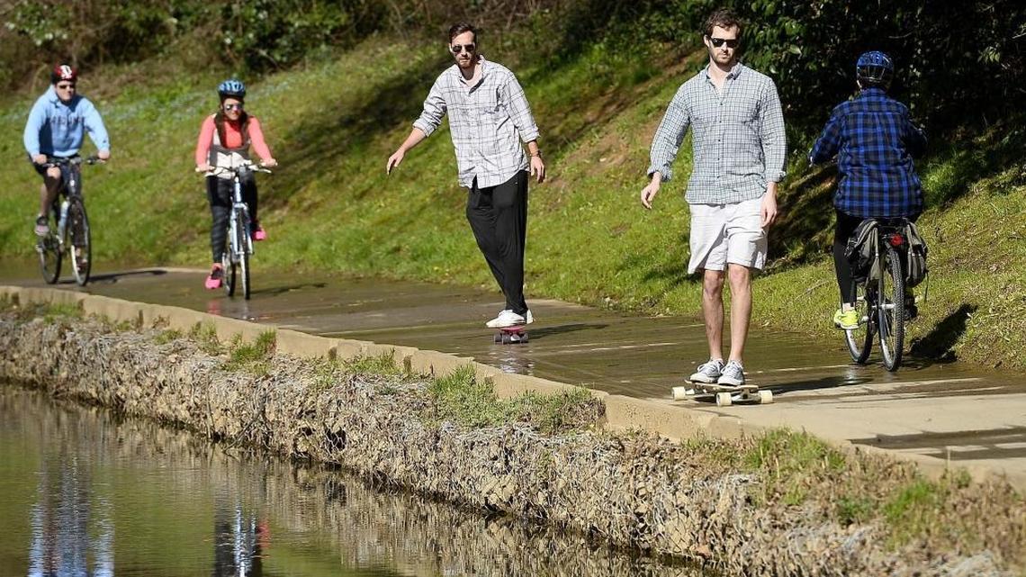 Skateboarders ride along Little Sugar Creek Greenway in this 2016 photo. A new segment of the Cross Charlotte Trail will extend the greenway by 0.4 mile.