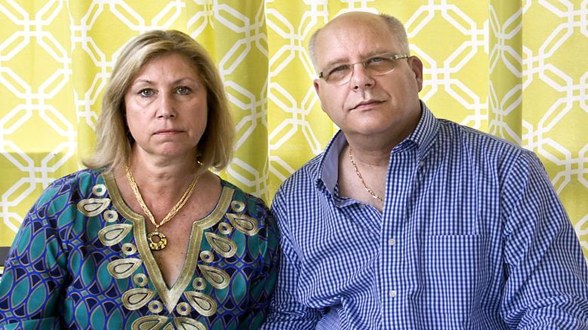 
Tom, 56, and Marla Bednar, 54, of Raleigh, who have been married for 24 years, pose at home on Tuesday, June 9, 2015, say that they were emotionally scared after they were arrested, had their home ransacked by authorities and had their assets seized in August 2014.
