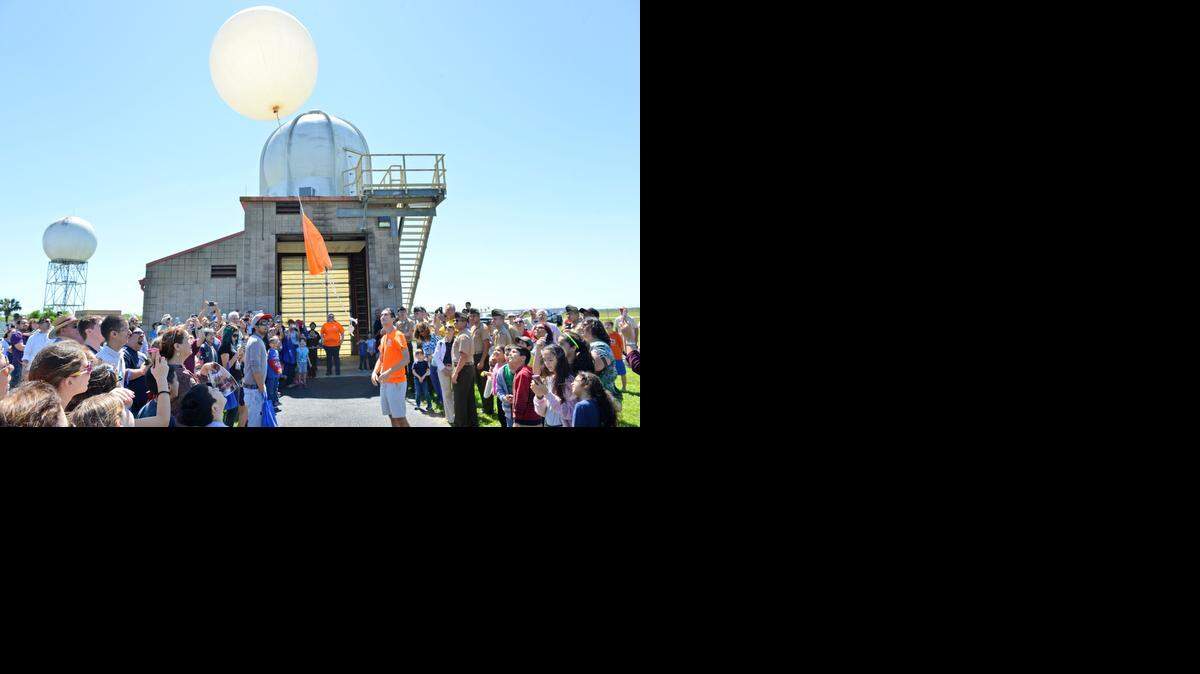 
People gather to observe a weather balloon release at the National Weather Service facility in Brownsville, Texas on March 28. 
