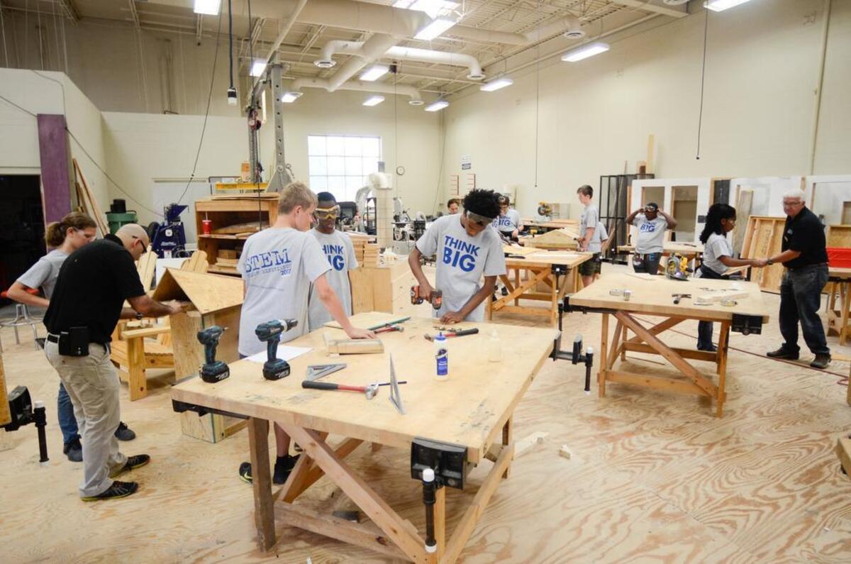 Local high school students work to build little free libraries for the community at one of CPCC's STEM Summer Experience camps on Wednesday. There are over 50,000 registered Little Free Libraries across the United States and 70 other countries, and over 100 of them are in the Charlotte area.