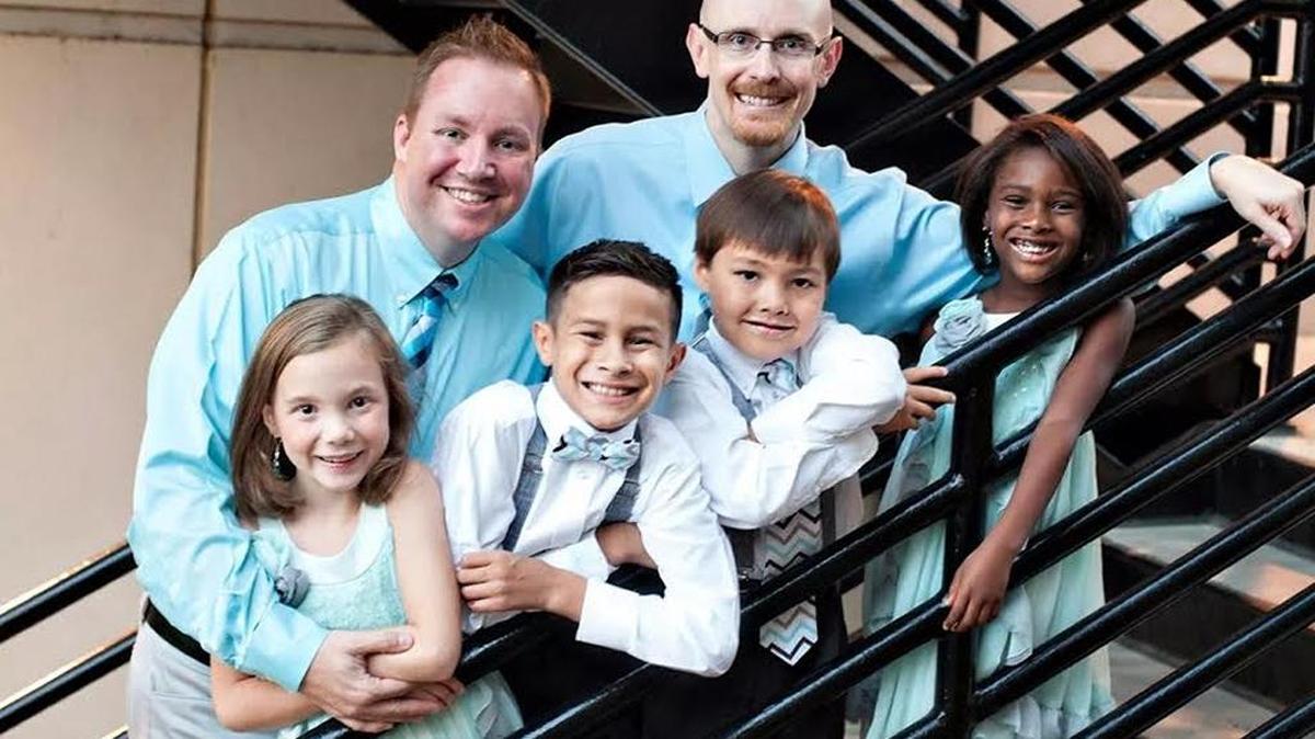 
Kevin Hindsman and Aaron Luckey of Charlotte with their children, from left, Avyn, Eli, Landon and Lillie after their wedding last year.
