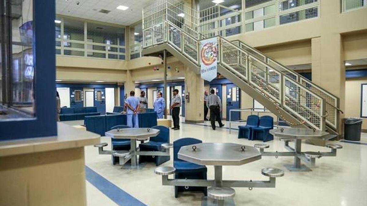 At the new therapeutic diversion unit at Central Prison in Raleigh, prison staff members talk to inmates. The unit is designed to give inmates intensive mental health treatment as an alternative to solitary confinement.