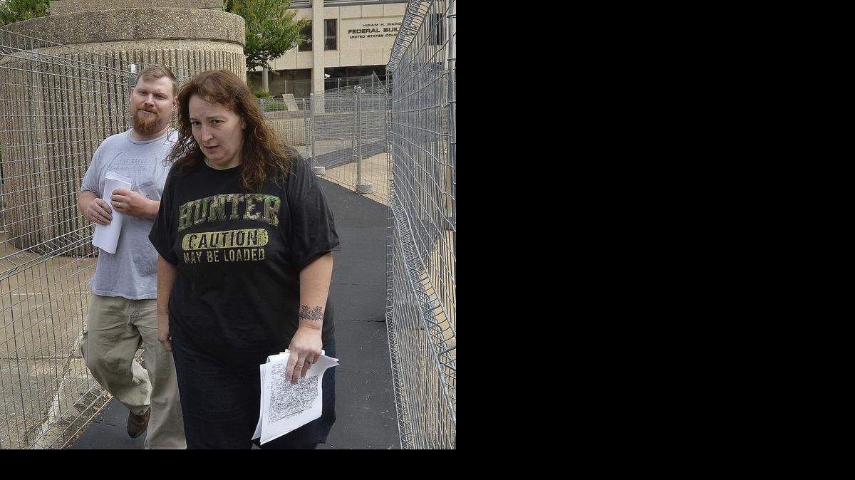 
From left, Sandy and Casey Parsons leave the Federal Courthouse in Winston-Salem after Casey and Sandy Parsons were arrested in 2014.
