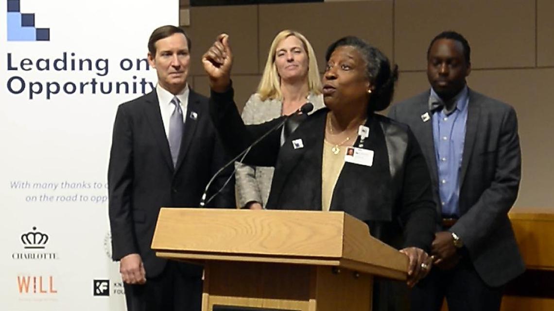 Dr. Ophelia Garmon-Brown, center, co-chair of the Charlotte-Mecklenburg Opportunity Task Force, spoke as its recommendations were released in March. She was joined by co-chair Dee O'Dell, left, and incoming Leading on Opportunity Implementation Council co-chairs Andrea B. Smith, center-rear, and James E. Ford.