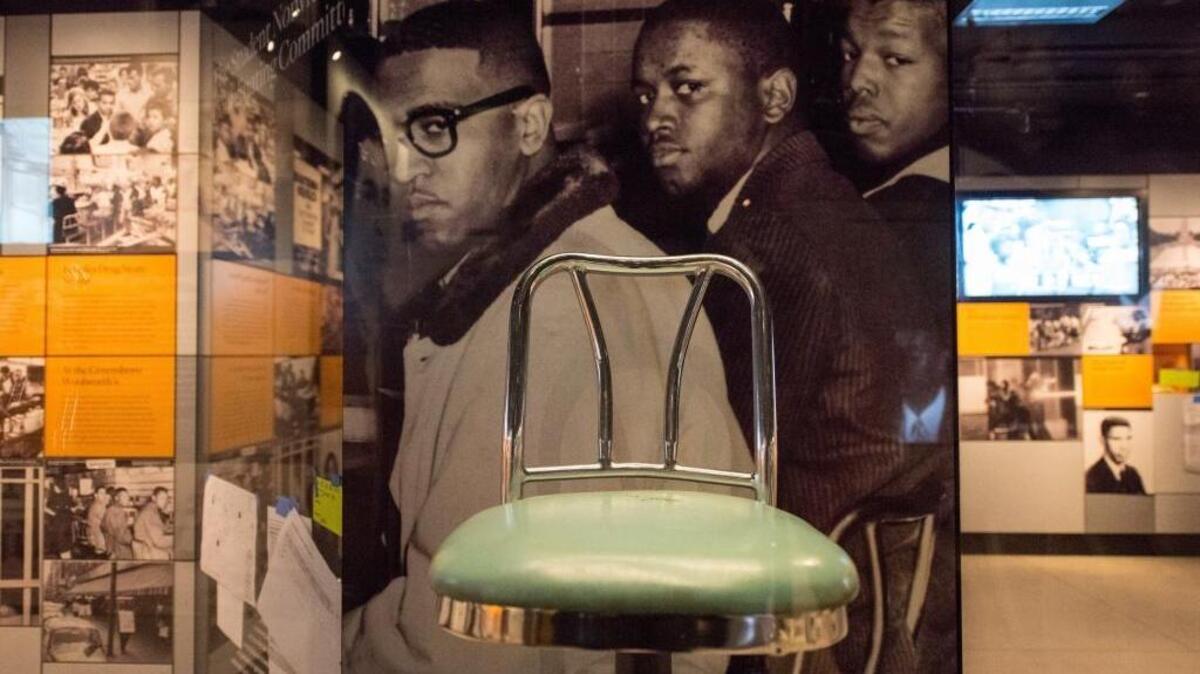 Woolworth Lunch Counter stools are exhibited at the Smithsonian's National Museum of African American History and Culture in Washington, D.C.