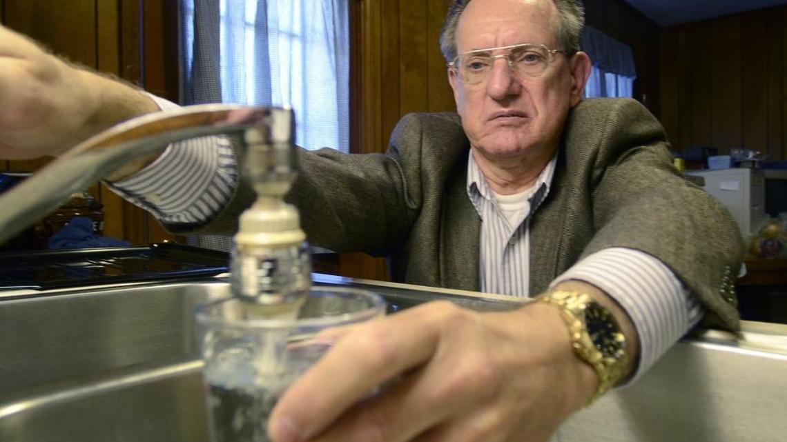 Dale Beck of Belmont, in this 2013 photo, lives across the street from an old coal ash pond at Duke's Allen plant.