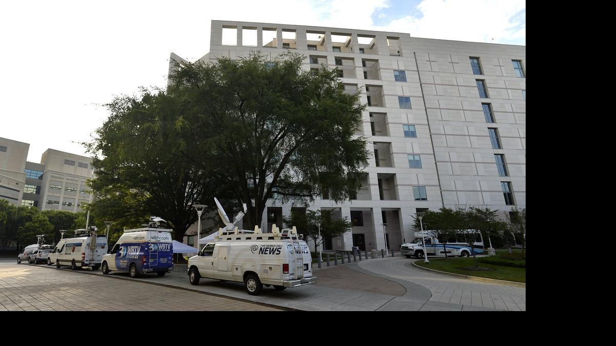 
Media vehicles parked at the Mecklenburg County Courthouse, Wednesday, July 21, 2015. 
